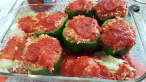 1 pound of ground meat and 2 cups of grain can yield 6 stuffed peppers and 6 - 8 cabbage rolls.